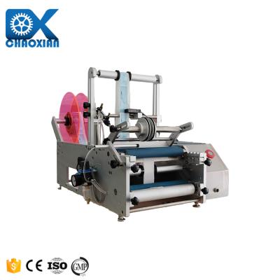 Cina Semi Automatic Yarn Wine Bottle Sticker Vertical Round Tuna Tube Labeling Machine Tincture Tin Can Labeling Machine in vendita