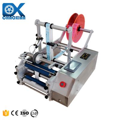 中国 Semi Automatic Table Top Double Sides Wet Glue Round Bottle Self-Adhesive Labeling Machine 販売のため