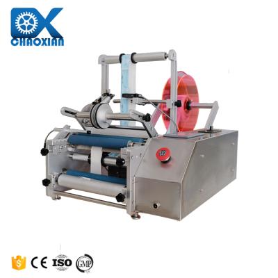 Cina Semi Automatic Mini Multipurpose Bottle Labeling Machine Orienting Neck Nail Polish Metal Can Oil in vendita