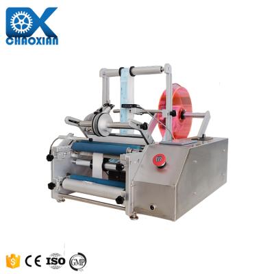 China Semi Automatic Transparent Sticker Round Bottle Labeling Machine For Round Glass Plastic Bottle for sale