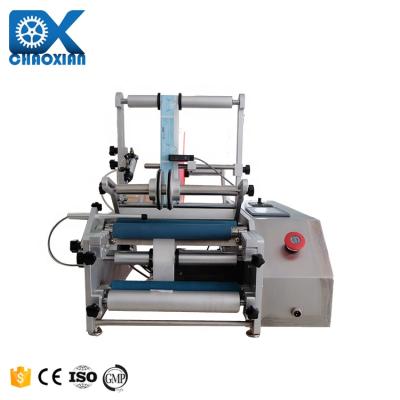 Cina Top Tube Label Applicator Two Corner Tri Roller Trigger Spray Semi Automatic Labeling Machine Glass Labeling Machine in vendita