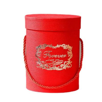 China Recycled Materials Round Gift Box Recyclable Cardboard Flower Packaging Gift Box Portable Wedding With Lid for sale