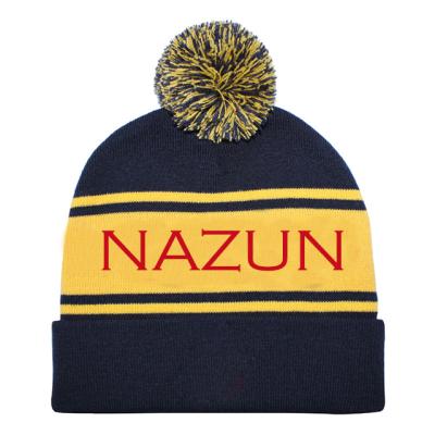 China JOINT Custom Embroidered Jacquard Knitted Beanie Hat with pom pom, flip hat for sale