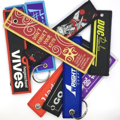 China Europe Woven Keychains OEM Factory Custom Logo Woven Key Chains For Remove Before Airplane for sale