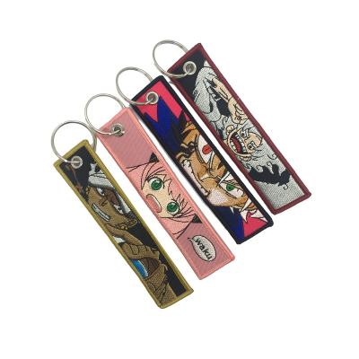 China 100PCS MOQ Polyester Promotional Gifts Customized Fabric Embroidery Key Chain Cheap Woven Embroidered Key Chain for sale