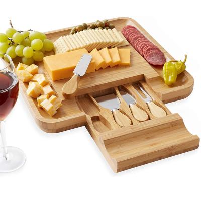 China Sustainable Bamboo Cheese Board With Serving Cutlery Set Meat Board With Slide-out Drawer With 4 Chamber Stainless for sale