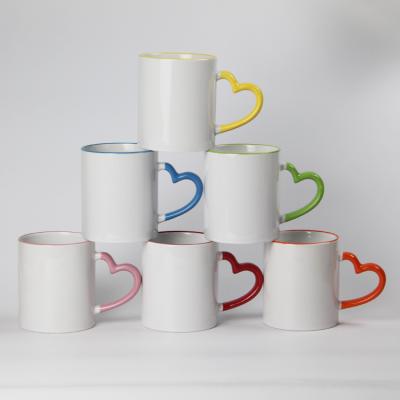 China Sustainable 11oz Sublime Coffee Mug With Color Heart Shaped Handle Inside Mug Wall for sale