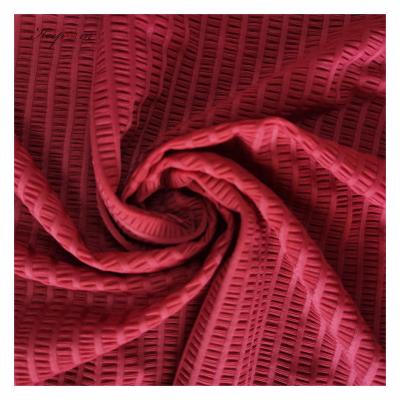 China Fashionable Keepwin brand jacquard top wear fabric stretch wrinkle fabric elastic swimwear fabric for sale