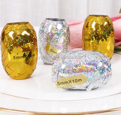 China Metallic Gift Wrapping Ribbon Plastic Gold And Silver Metallic Ribbon For Decoration for sale