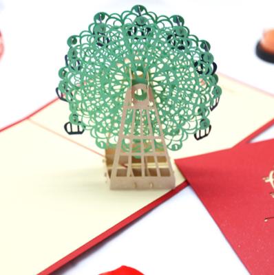 China Hot Selling Ferris Wheel Hollow Engraving Handmade 3D Architectural Sculpture Green Pop Up Greeting Cards Wholesale for sale