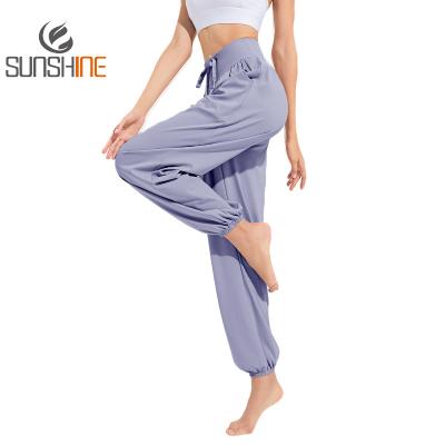 China Custom Loose Casual Quick Dry Breathable Sports Pants Slimming Dance Running Yoga Pants Tied Fitness Clothing Foot Guard Pants for sale