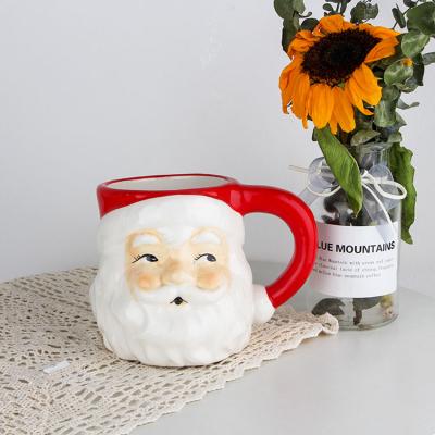 China 2021 Custom Made Viable Handmade 3D Christmas Porcelain Santa Shaped Coffee Ceramic Cup Mugs For Family Gifts for sale