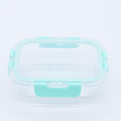 China 2021 Freshness Preservation Bento Lunch Box High Borosilicate Glass Portable Glass Food Container With Light Green Silicone Cover for sale