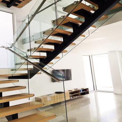 China Modern contemporary steel stairs and stair stringers metal landings with glass stair railing for sale