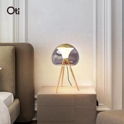 China Oti Modern Iron Tripod Floor Table Lamps Glass Cover Wood Bedroom Bedroom Lights Floor Table Lamp for sale