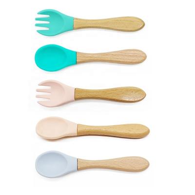 China Multicolor MOLLE Baby Training Spoon and Fork Silicone Table Take Care Baby Feeding Spoon for sale