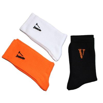 China Winter Solid Color Sporty Unisex New Letter V For Friends Custom Design Street Trend Grip Cotton Socks for sale