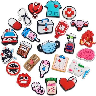 China Custom Clog Charm Christmas Clog Cartoon Letter Logo Flower Decoration Accessories PVC Care Stethoscope PVC Designer Shoes Charms For Croc for sale