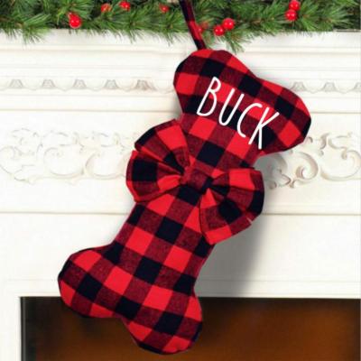 China Pet Christmas bumps 2021 Hot Sale Red and Black Dog Bone Stocking Christmas Plaid Decoration Supplies Bulk for sale