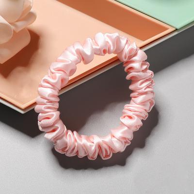 China Goods 100% 1CM Pure silk hair ties custom logo and width of woman silk ponytail accessories scrunchie for sale