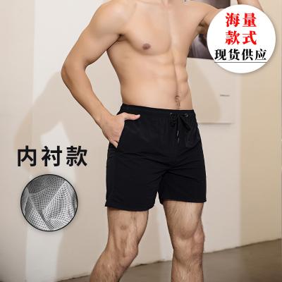 China 2022 European and American polyester coil men's pants beach spring and summer loose quick-drying seaside vacation shorts swimming quarter pants for sale