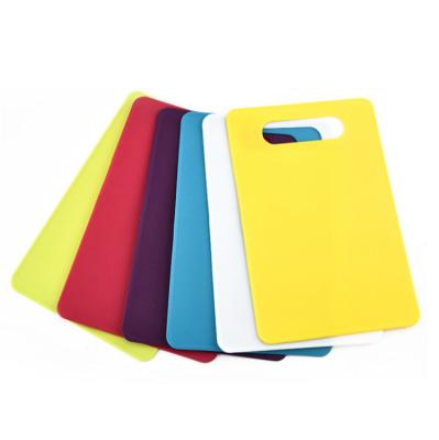 China Sustainable Colored Flexible Plastic Cutting Board Mats With Holes For Hanging for sale