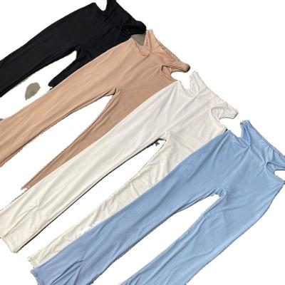 China Breathable Women Summer Clothes 2022 Fashion Hole Flare Pants Street Mid Waist Bottom Split Solid Women Leggings for sale