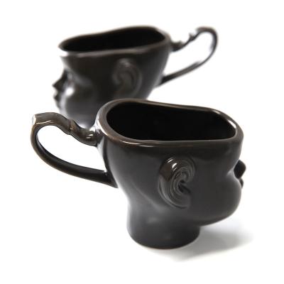 China 200ML Viable Ceramic Mugs Creative Black People Coffee Mugs With Gold Handle Cups For Milk Tea Gifts for sale