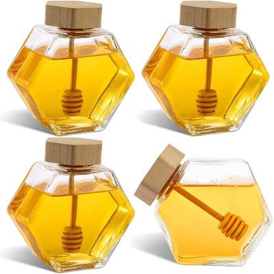 China Food Honey Pot Jar Factory Supplier Empty Hexagon Shape Transparent Glass Jam Jar With Wooden Dipper For Home Kitchen for sale