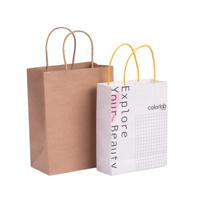 China Recyclable Wholesale Custom Logo Printing Brown Kraft Paper Bag Pouch Bag Handle Strong Kraft Paper Bags for sale