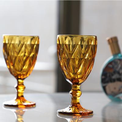 China Hot Wholesale Amazon Vintage Glass Goblet Machine Pressed Luxury Embossed Colorful Wine Glass Wedding Party Water Goblets for sale