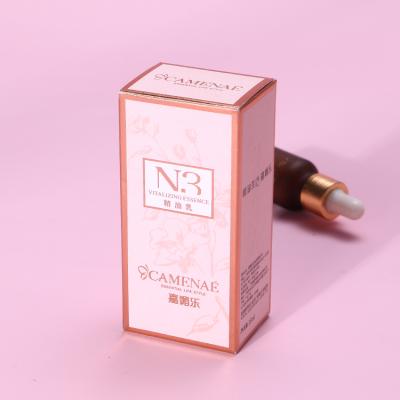 China Recyclable Custom Ivory Paper Rose Gold Paper Cosmetic Packaging Box With Embossed Silver Foil For 15ml Skincare Essential Oil Bottle for sale