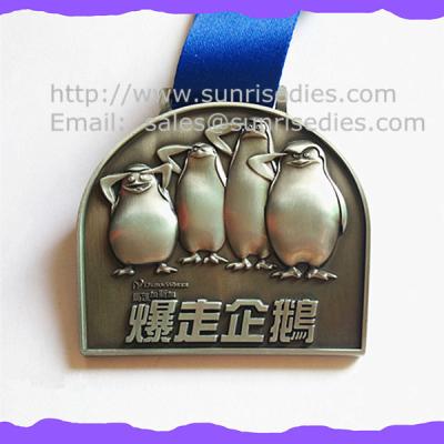 China 3D engraved penguin medals, OEM zinc alloy 3D metal medal with ribbon China for sale