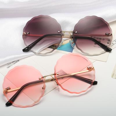 China New Fashion Wholesale Arrvial Round Rimless Oversized Round Pink SunglassesUV 400 Protection Sun Glasses For Ladies Eyewear for sale