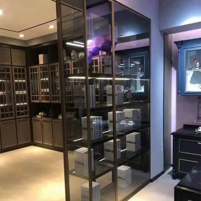 China Luxury High End Custom Glass Wardrobe 16MM Cabinet System Bed Modular Bedroom Clothes Almirah Aluminum Alloy Buffet for sale