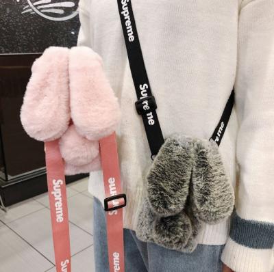 China 2022 Amazon Rabbit Ears Plush Shockproof Hot Selling Luxury Fluffy iPhone Case For 13 12 11 Soft Case With Strap for sale