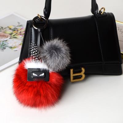 China Real Fur Ball Pom Pom Key Chains For Key Chains Fluffy Fluffy Ball Custom Made Luxury Luxury Fur Keychain for sale