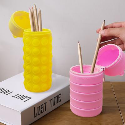 China Popular Factory Wholesale Colorful Cute Foldable Portable Kids Bubby Toy Round Shape Silicone Pen Stand Holder Desk From Popular Factory for sale