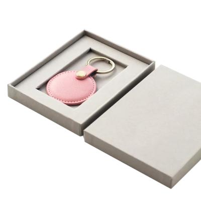 China New creative leather round key chain promotion business gift set luxury round leather key chain for gift for sale