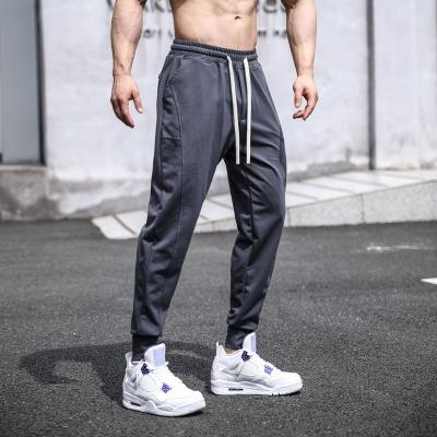 China Anti-wrinkle New Drawstring Long Trousers Cotton Men Comfortable Relaxed Fitted Sportswear Activewear Jogger Pants Gym Sweatpants for sale