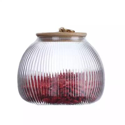 China Steamable Ribbed High Borosilicate Vertical Stripe Details Food Storage Glass Jar Bamboo Lid With Metal Hanging for sale