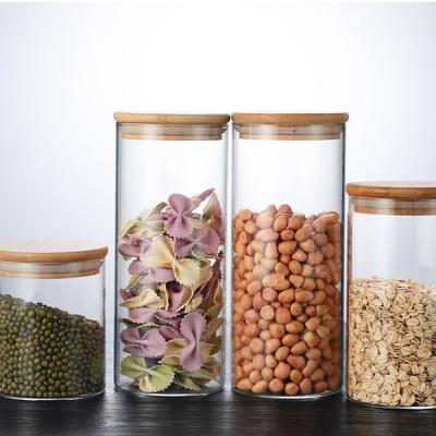 China 2023 New 250ml Storage Bottles And Jars Steamable Food Storage Container With Airtight Bamboo Lid Borosilicale Clear Glass Jar for sale