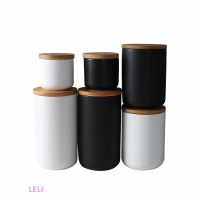 China Well Made Black White Ceramic Freshness Preservation Jars With Lids/Ceramic Coffee Storage Container Lid Storage Airtight Wood Jar for sale