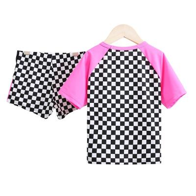 China Breathable Fashionable Design Black And White Grid With Pink Red Girls Swimwear Slit Swimwear Set for sale