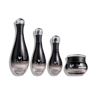 China Fashion Design Luxury High End Bowling Ball Shape Cosmetic Set Skin Care Glass Bottle Cream Jar Packaging Set for sale