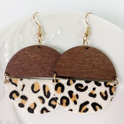 China Vintage Fashion Bohemian Cowhide Leopard Print Horsehair Stud Earrings European Cowhide Print Semicircular Wooden Earrings for sale