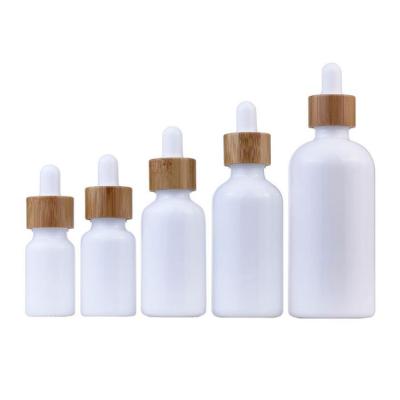 China 5ml Cosmetic - 100ml Cosmetic Tincture Opal Essential Oil Packaging White Glass Bottle With Bamboo Dropper Pipette for sale