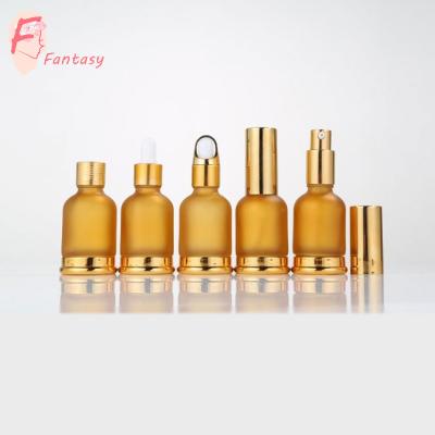 China Personal Care Gold Eco Friendly Custom Design 30 ml CBD Glass Oil Bottle With Gold Cap for sale