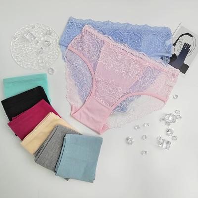 China New style breathable cotton wholesale triangle sexy ladies panties lace up transparent seamless mid-waist ladies breathable underwear for sale