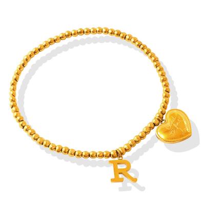 China FASHIONABLE Hot Selling Accessories 18K Gold Plated Letter R And Beaded Elastic Bangle Stainless Steel Pendant Bangle Jewelry for sale